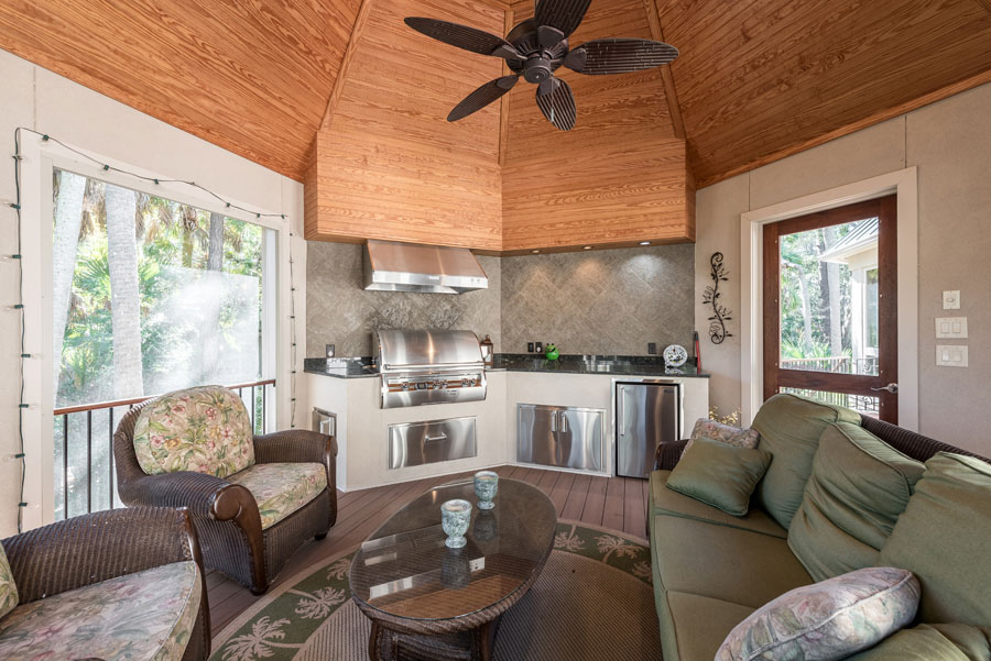 backyard indoor space with small kitchen and couch