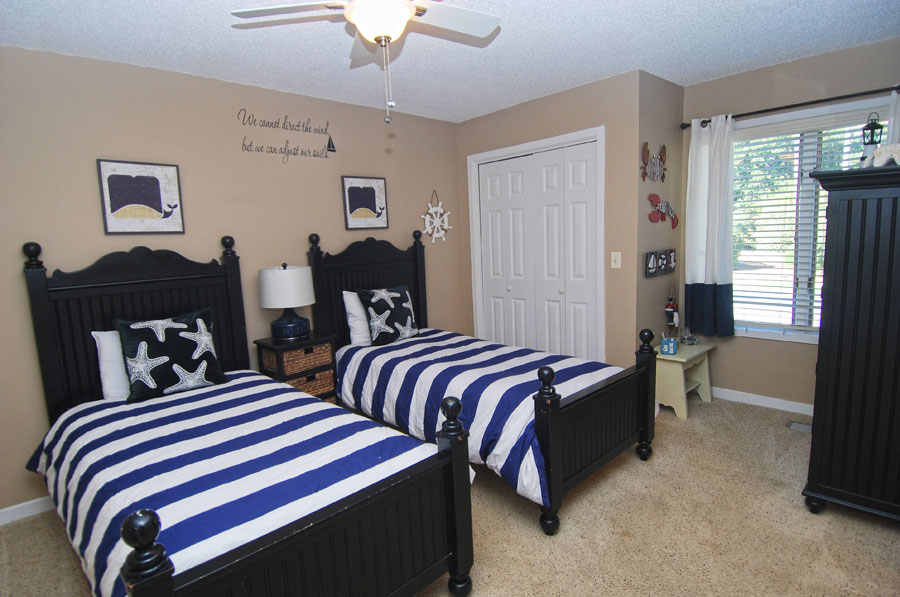 beach house bedroom with two single beds
