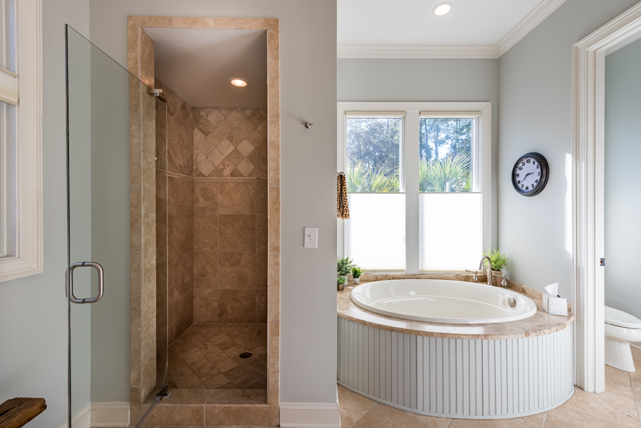 seabrook island home bathroom with shower and tub