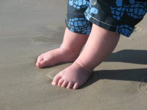 baby feet in the sand