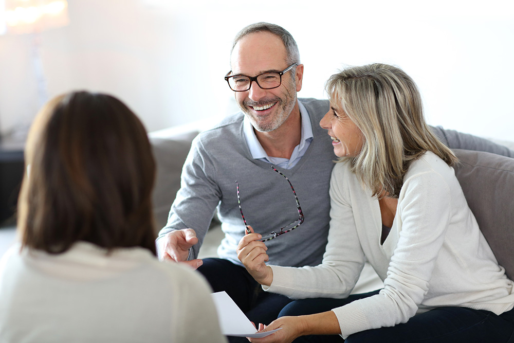 couple talking with Seabrook Island Real Estate agent